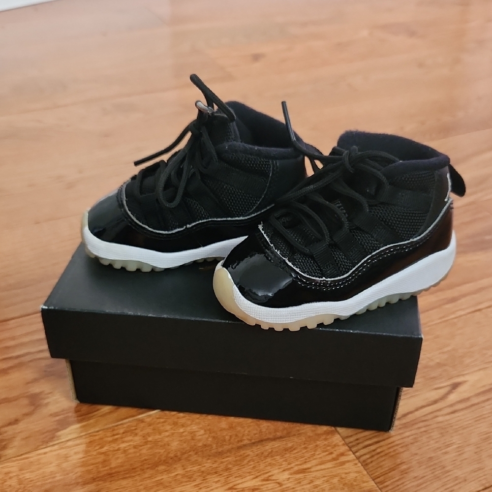 Jordan Retro 11 Black and White Sneakers with Patent Leather